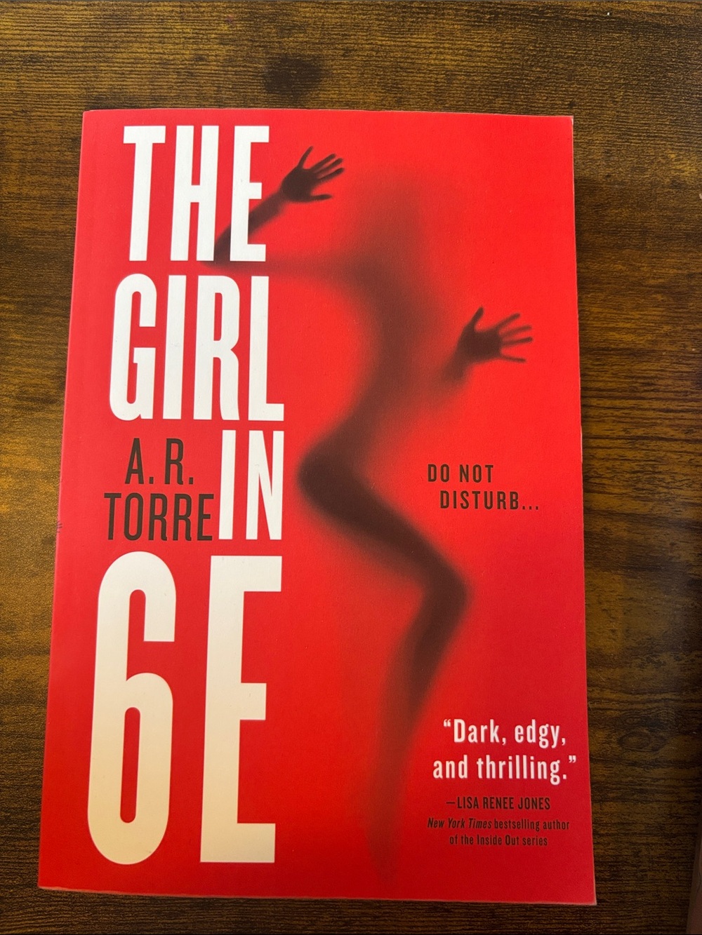 The Girl in 6E by A.R. Torre - Red Paperback Thriller